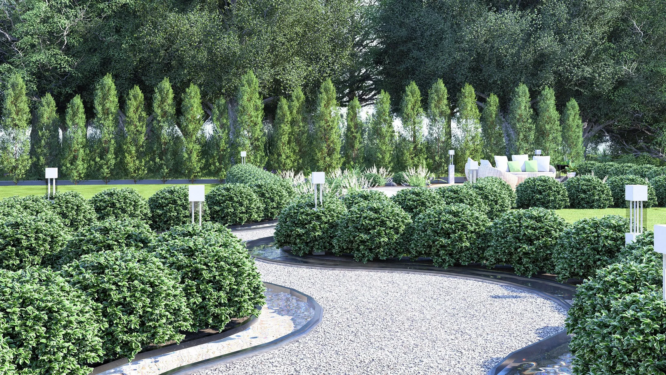 Gravel path between rounded shrubs with bollard lights