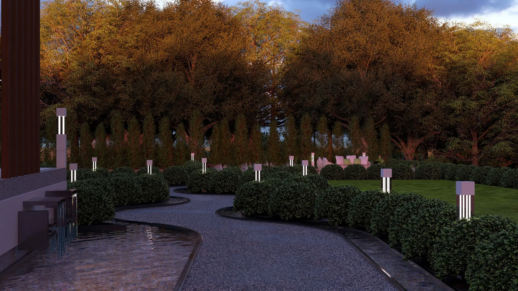 Gravel path and water rill at sunset with lights on