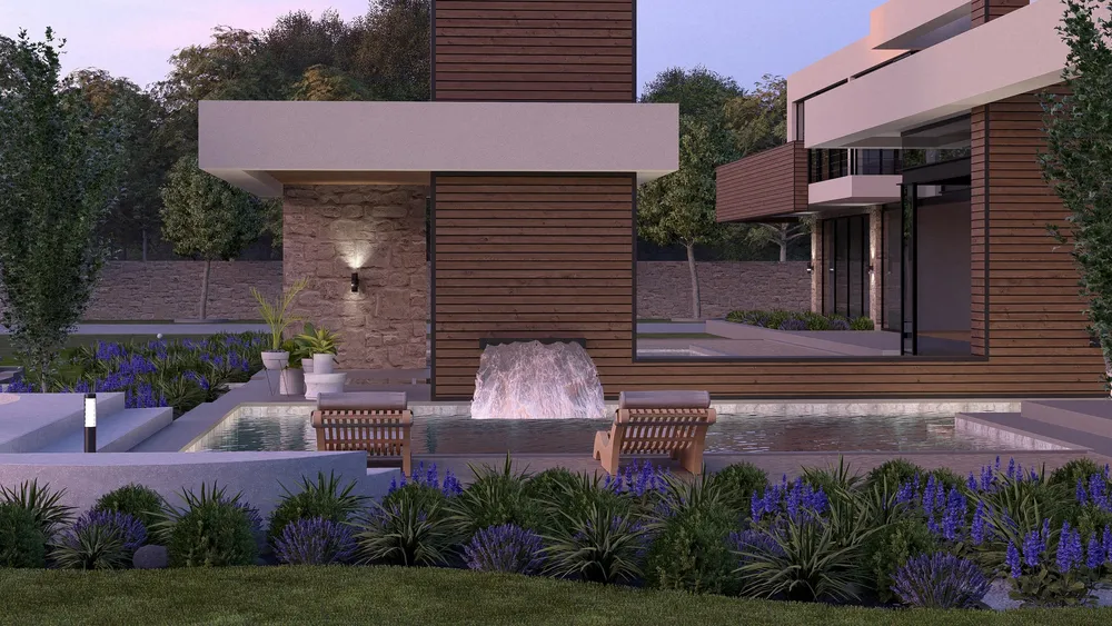 Lit cascade and pool at dusk
